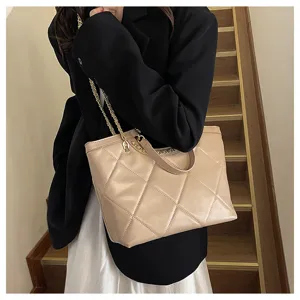 Chic quilted chain tote bag for women, stylish beige leather shoulder handbag for daily work commute.