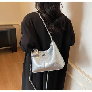 Stylish silver crinkled leather underarm shoulder bag with chain strap and mini pouch detail.