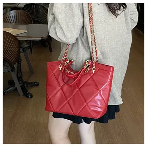 Women red quilted tote bag with chain strap, stylish large capacity commuter shoulder bag.