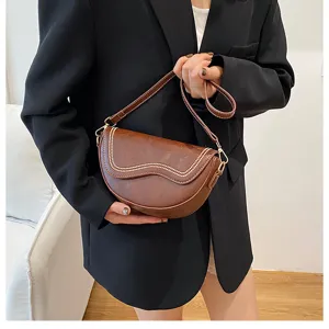 Retro brown PU leather saddle bag, stylish single shoulder crossbody bag for women daily use.