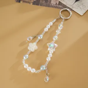 Elegant beaded phone charm with pearls iridescent star flower and teardrop pendant.