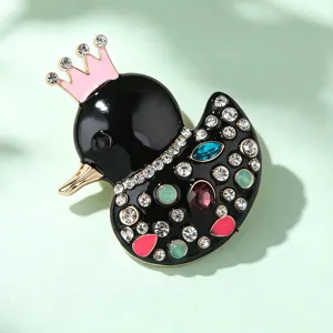 Cute black duck brooch with pink crown and sparkling rhinestones. Elegant lapel pin.