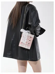 Chic Lolita style pink book shaped crossbody bag with cute white lace and bow details.