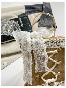 Cute princess style daily commuting box bag with sweet lace bow and crisscross lacing detail.