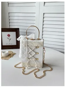 Detailed view of the cute Lolita white box handbag featuring delicate lace trim, ribbon bow, and gold chain strap.