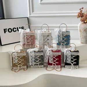 Cute Lolita lace-up box handbag with metal handle and chain, stylish shoulder bag for women.