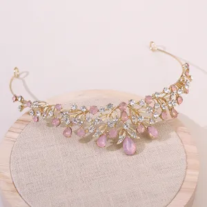 Superbe tiare de mariée dorée avec strass roses, idéale pour les mariages et les fêtes.