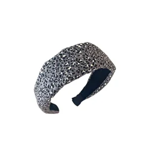 Elegante diadema acolchada ancha con estampado de leopardo gris para mujer vintage.