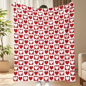 Cozy red and white heart checkered flannel blanket for warm home decor and autumn styling.