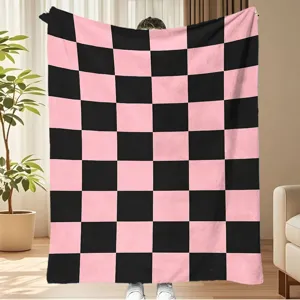 Pink and black checkered flannel blanket, cozy thick fleece throw for autumn and winter room decor.