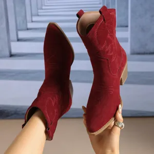 Red suede western cowboy boots for women with stylish pointed toe and chunky heel embroidery.