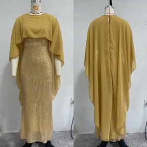 Close up detail of gold sequin evening dress, featuring elegant cape overlay and sleek fit.