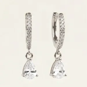 Silver teardrop pave huggie hoop earrings detail, sparkling crystal fashion jewelry
