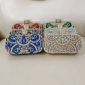 Exquisite rhinestone evening clutch bag with sparkling crystals and metal frame for party.