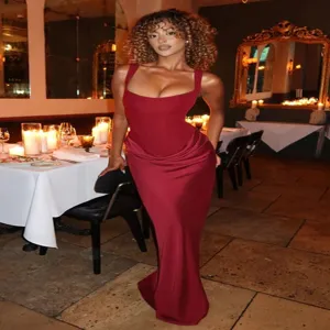 Detailed shot of the elegant burgundy satin long dress featuring a flattering scoop neckline.