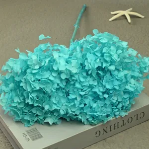 Blue preserved hydrangea single stem flower macro shot for handmade home decor and floral arrangements.