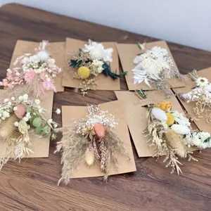 Mini dried flower bouquets preserved floral arrangements with kraft paper backing for wedding decor.
