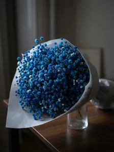 Blue baby's breath dried flower bouquet detail, romantic home decor floral arrangement.