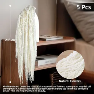 White hanging dried flowers detail, natural floral decor for wedding and home decoration.