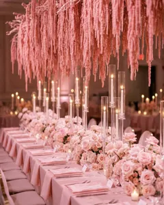 Exquisite hanging pink amaranthus and table floral decor detail for wedding and party setups.