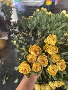 Detailed view of dried yellow roses bouquet, perfect for DIY craft and gift material.