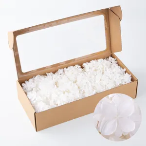White preserved hydrangea dried flowers in kraft window box for DIY floral craft and decor.