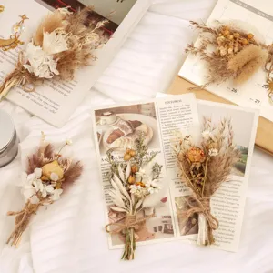 Detail view of mini dried flower bouquets for boho wedding table decor and rustic home styling.