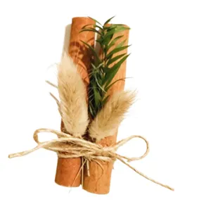 Decorative dried cinnamon stick bouquet with rabbit tail grass and natural jute twine bow.