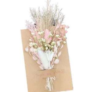 Mini dried flower bouquet close-up, preserved floral arrangement with craft card for gifts.