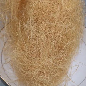 Natural raffia hemp fiber filling material detail close up for gift box packaging and decoration