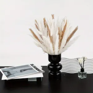 Natural dried pampas grass bouquet with black ceramic vase modern home decor arrangement.