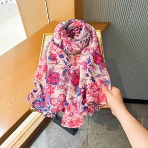 Floral print scarf detail view, elegant pink and purple tones, lightweight summer accessory.
