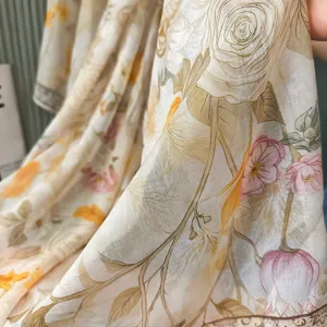 Close-up textile detail of the vintage floral print summer sun protection scarf.