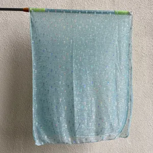 Detailed view of light blue sequin mesh scarf, showcasing sparkling texture and fine edges.