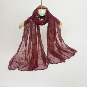 Burgundy sheer sequin scarf detail shot, lightweight mesh shawl fabric display view.