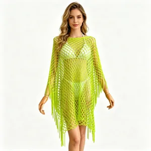 Neon green mesh fringe beach cover-up detail, hollow-out poncho vacation top close-up.