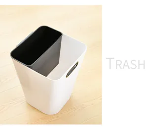 Detail view of a modern double compartment trash can with pressure ring for kitchen and home use.