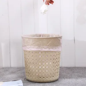Plastic hollow trash can with leaf pattern, lidless waste basket for home bathroom and living room.