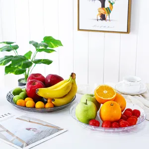 Plateau à fruits en plastique transparent style européen pour salon et rangement de snacks.