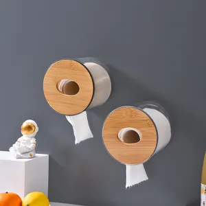 Wall-mounted round toilet paper holder, clear acrylic with natural bamboo wood ends for bathroom.