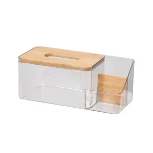 Scatola per fazzoletti in plastica trasparente con coperchio in bambù e scomparto.