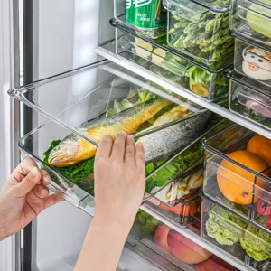 Clear refrigerator storage box with sliding drawer and lid, large capacity plastic kitchen organizer.