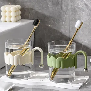 Transparent glass mouthwash cup with handle and toothbrush set for home bathroom use