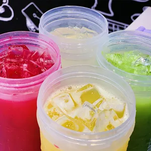 Colorful plastic sports shaker cups with ice cubes, large capacity fitness water bottles.