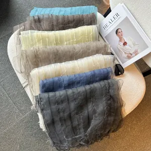 Lightweight organza fringe scarf with delicate texture, elegant spring summer accessory.