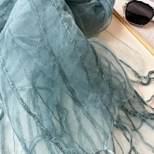 Lightweight organza fringe scarf with feather texture, blue-green spring summer accessory.