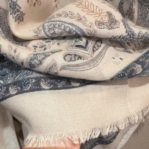 Detailed view of an ethnic paisley scarf with fringe, soft fabric, perfect for travel and daily wear.
