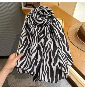 Detailed view of the black and white zebra pattern fashion ribbon scarf, elegant style.
