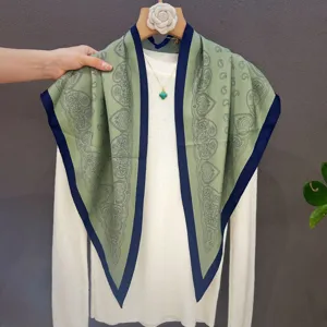 Elegant green paisley triangle silk scarf for women, versatile neckerchief fashion accessory.