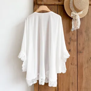 White chiffon cardigan detail, delicate lace trim on hem and sleeves, perfect summer resort wear.